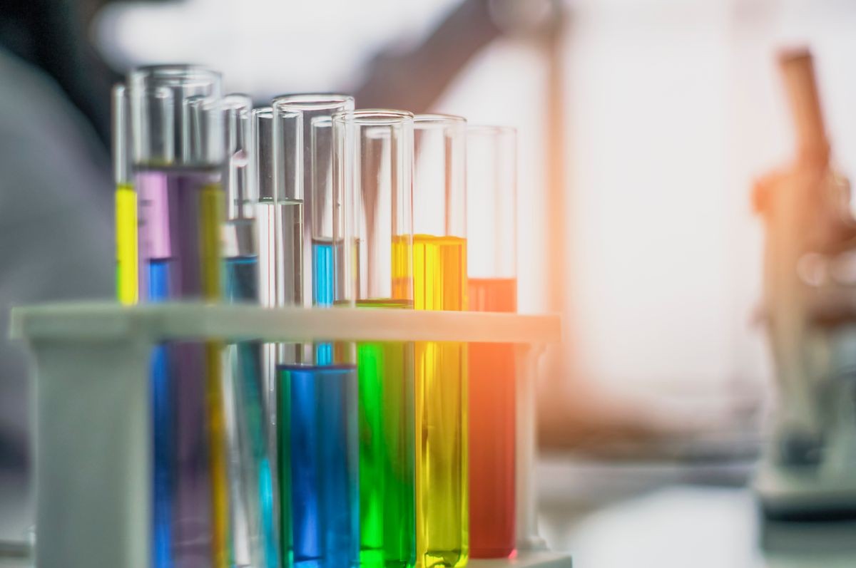 Chemical tube, put on table, With colorful fluids, In glass tubes for cosmetics from notebooks, in the laboratory, the concept develops safe formulas for consumers.